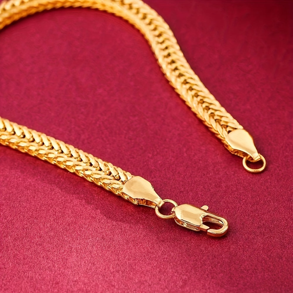 Gold fox tail chain clasp detail on deep red background