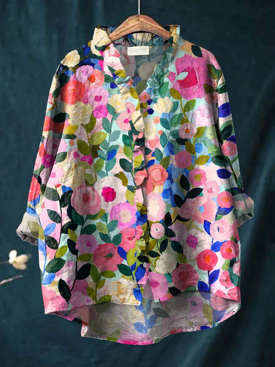 Elysande blouse in pink painted floral print, front view on hanger