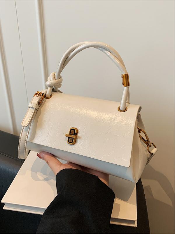 Emma small crossbody satchel in white, front view with adjustable strap