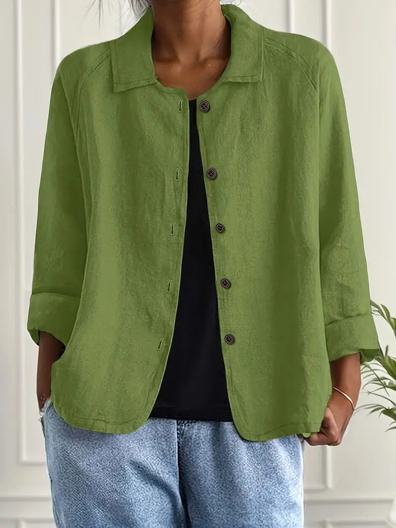 Calliste blouse in moss green, worn open over black top with denim, front view