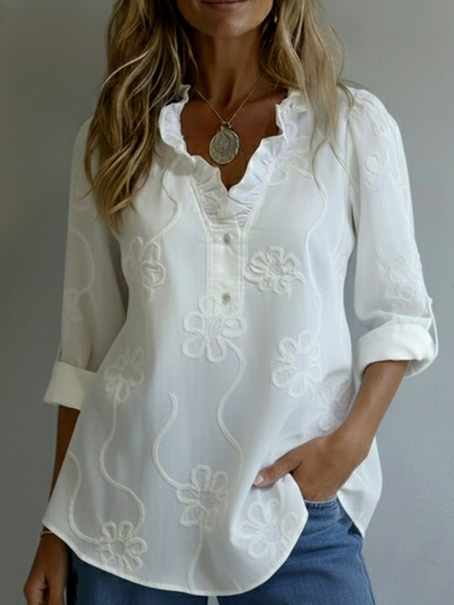 Amelia embroidered blouse in white, front view with ruffled V-neckline