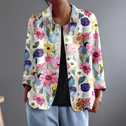 Rosamonde floral blouse in cream, worn open over black with pale denim