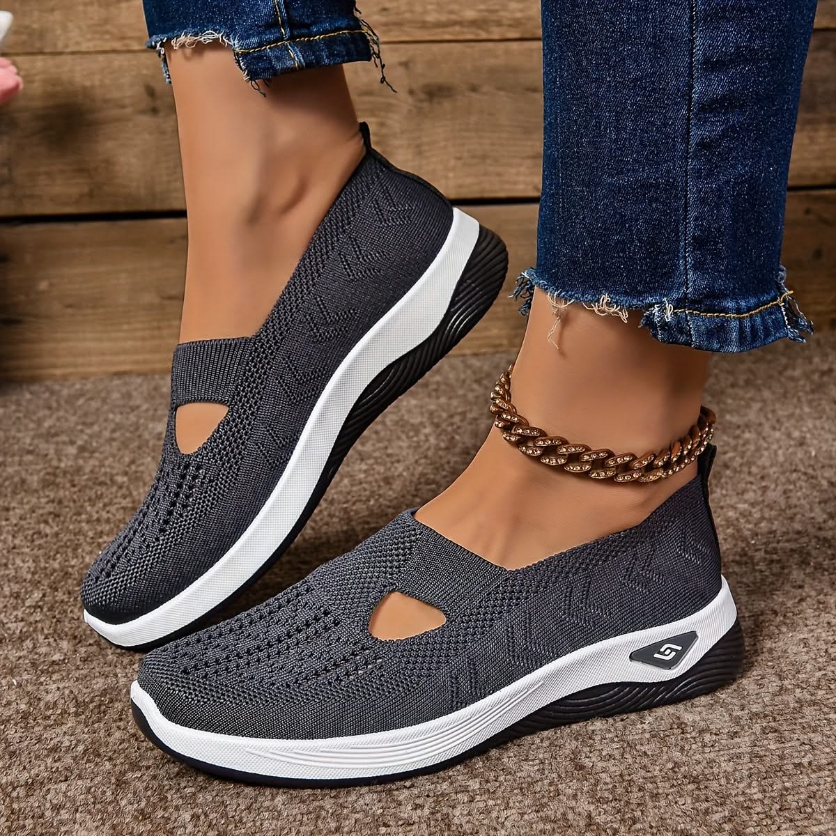 Elara slip-on sneakers in grey, worn side view