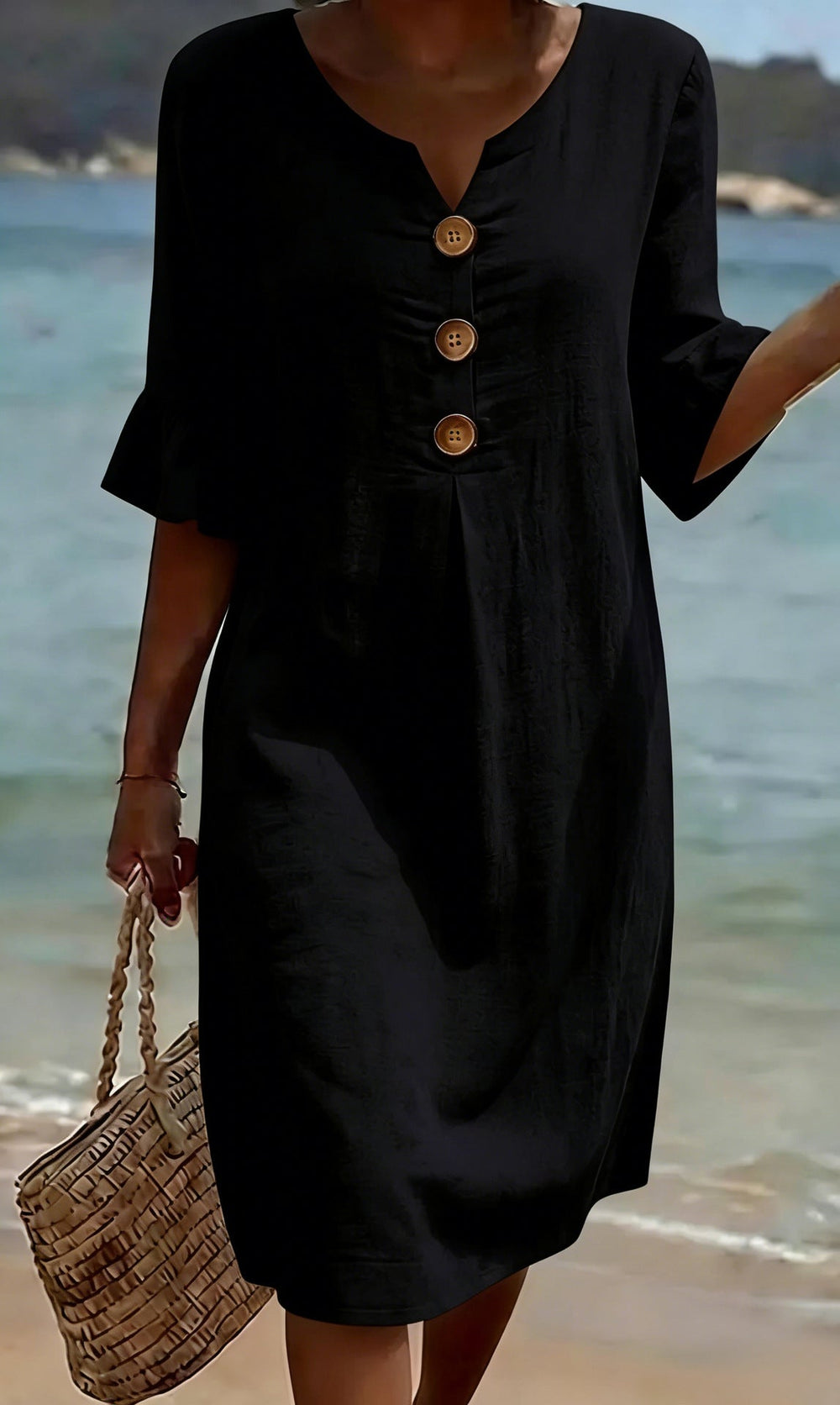 Black button-front casual dress in black, full-length front view on the beach