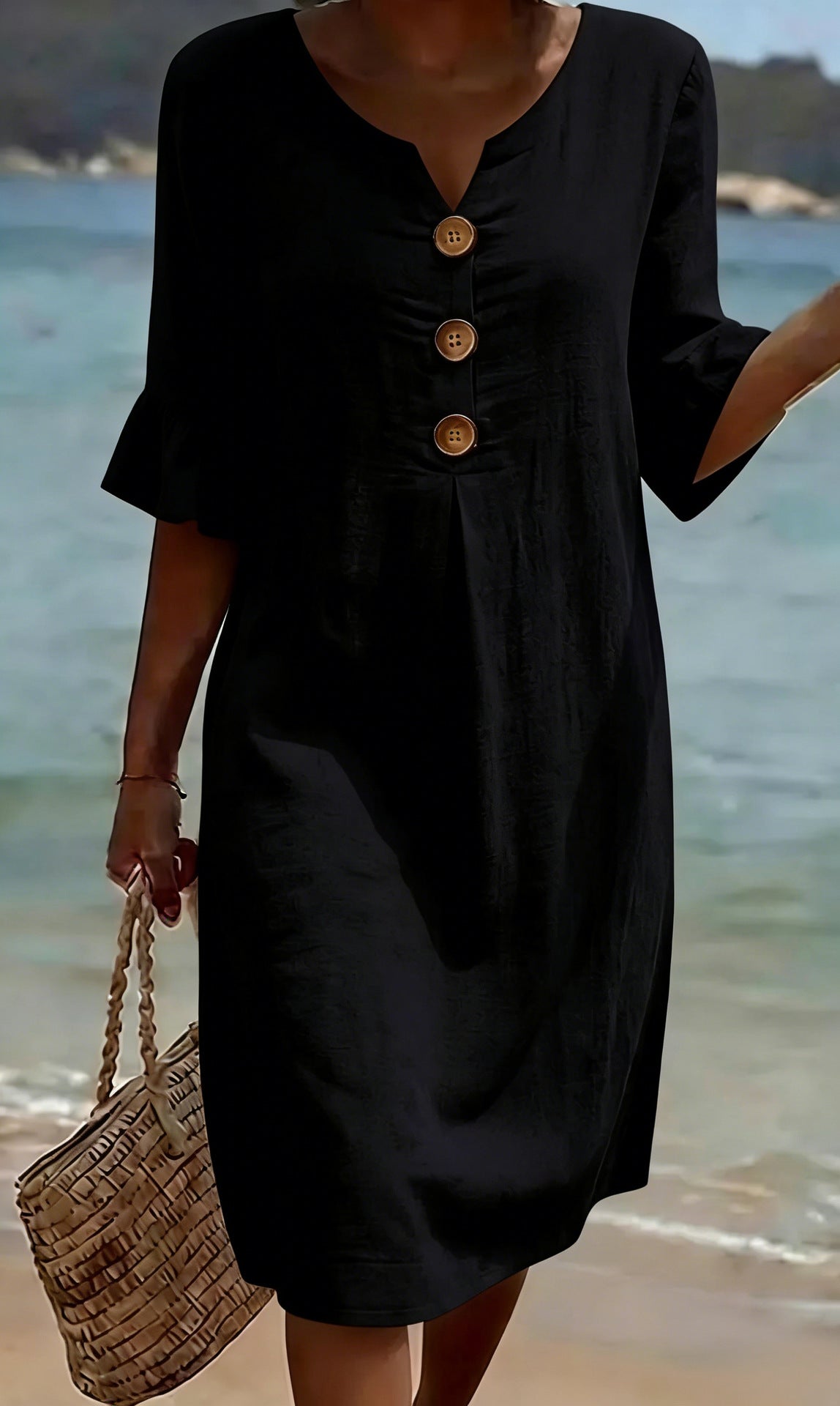 Black button-front casual dress in black, full-length front view on the beach