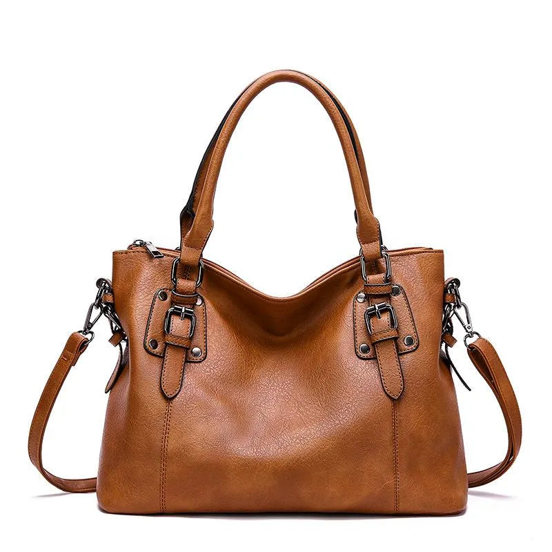 Evadne shoulder bag in brown with shoulder strap attached