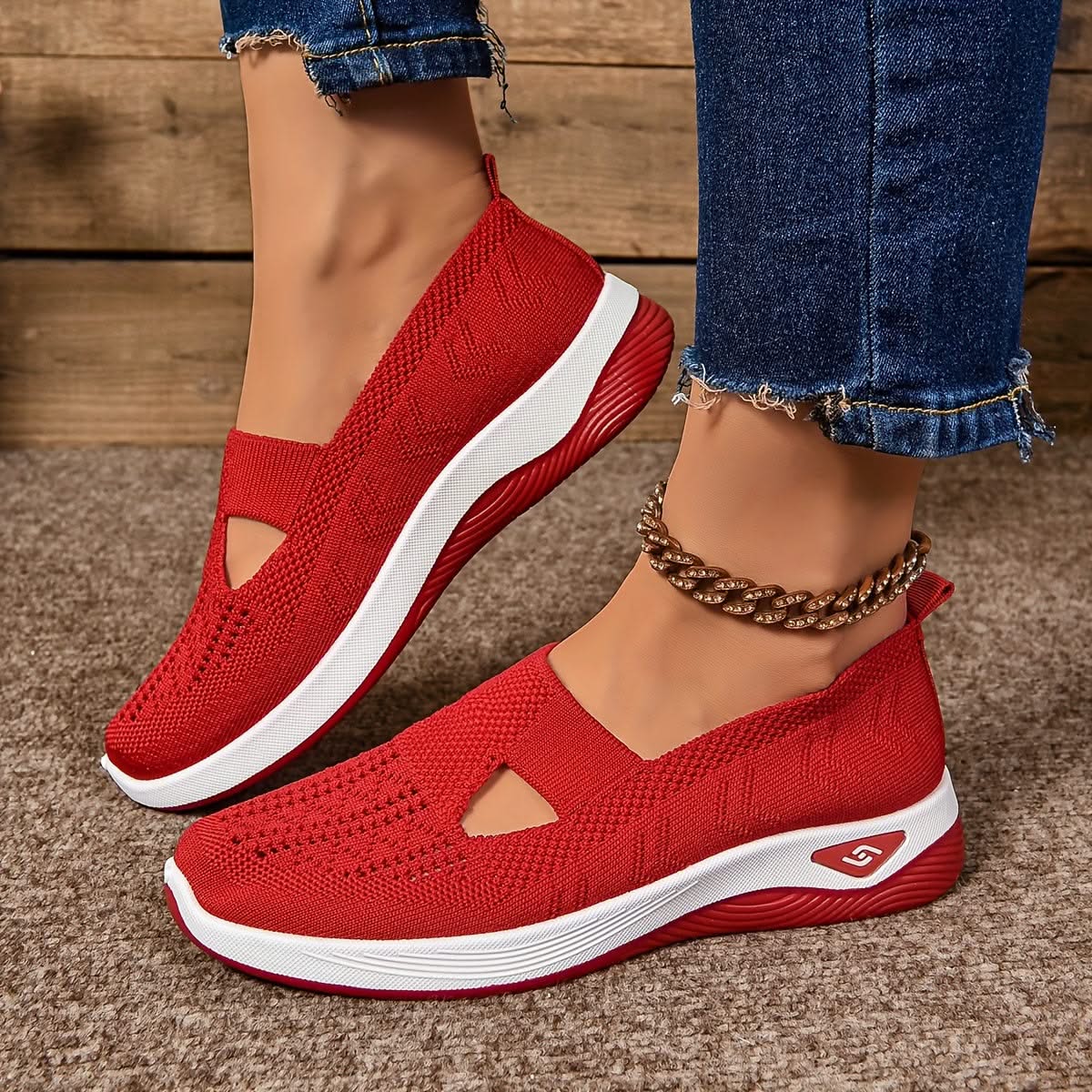 Elara slip-on sneakers in red, worn side view