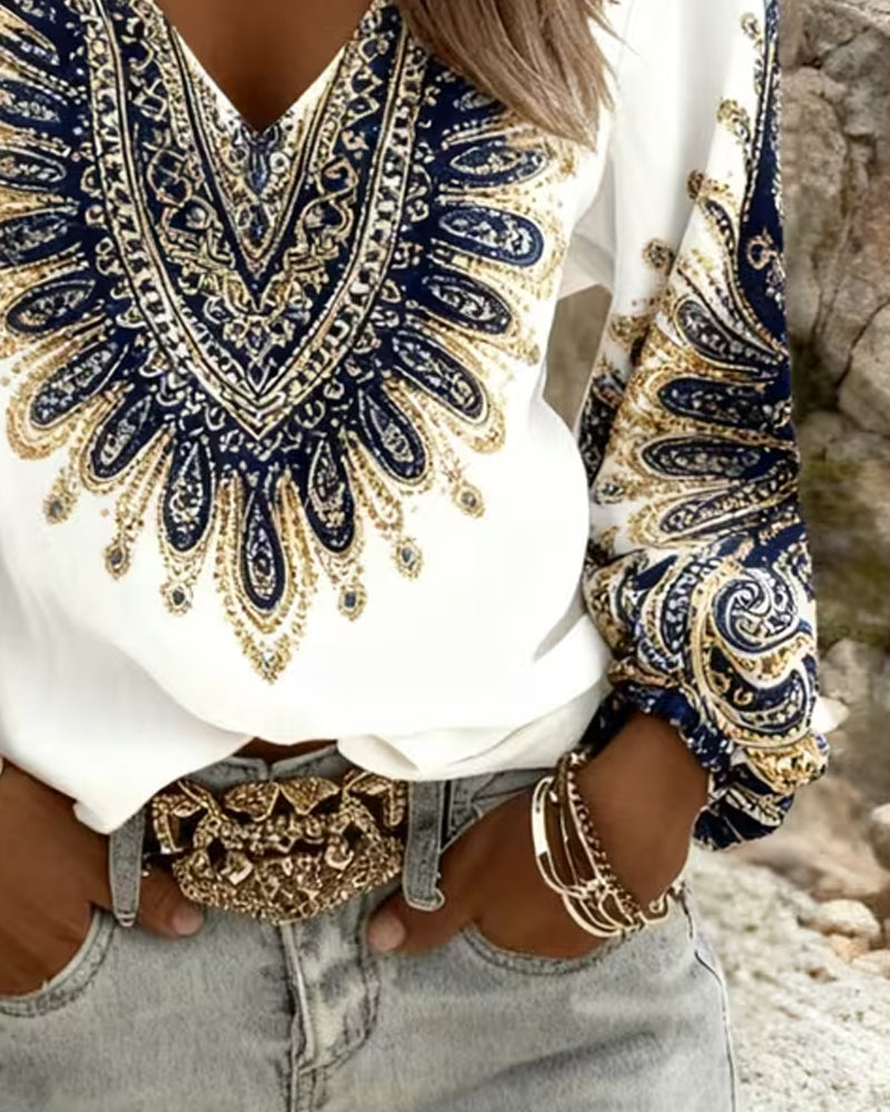 Elara paisley print blouse in blue, close-up of print and sleeve