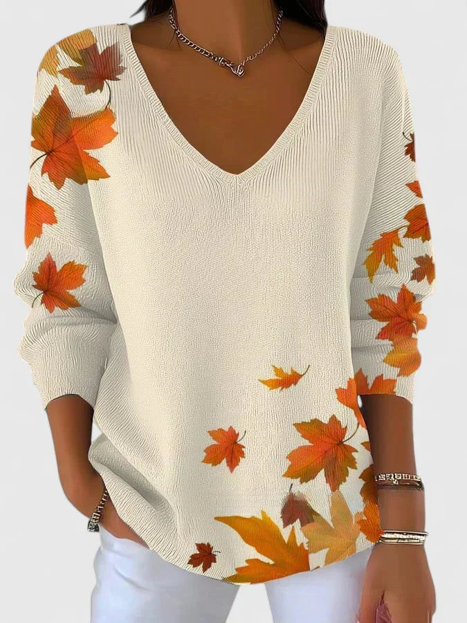 Sera V-neck sweater in white with maple leaf print, front view