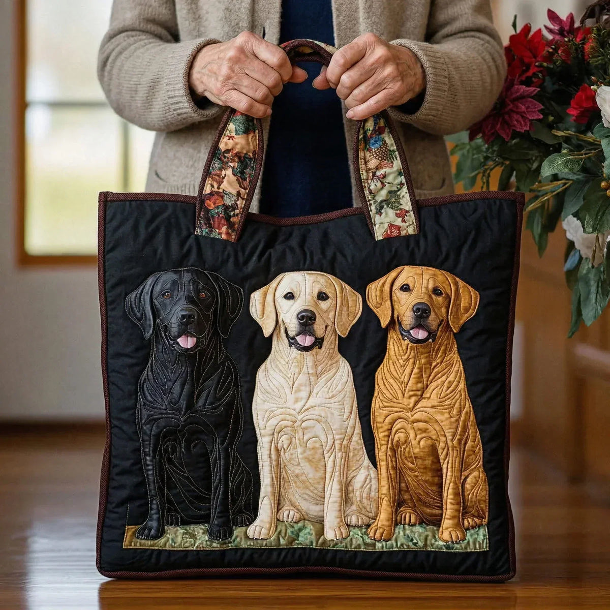 Woman holding the black three Labradors tote bag by both handles