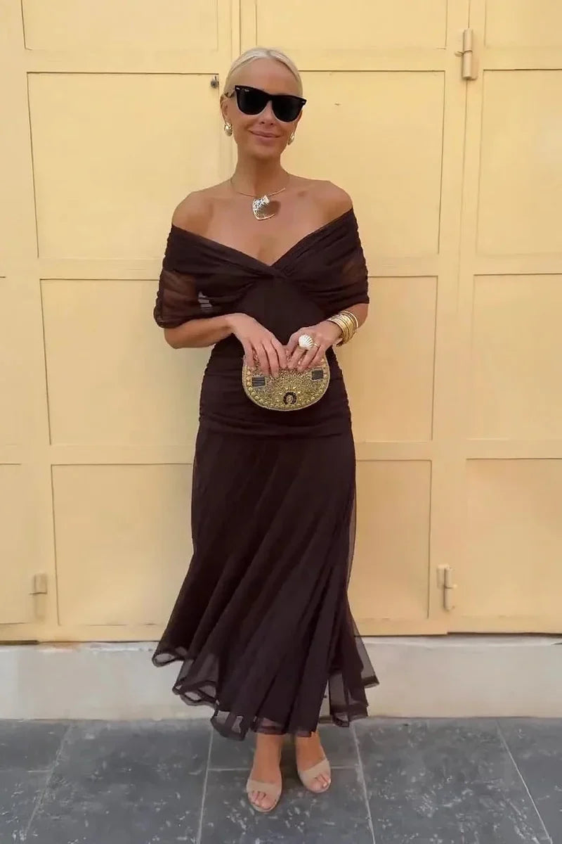 Eliza maxi dress in brown, worn off the shoulder