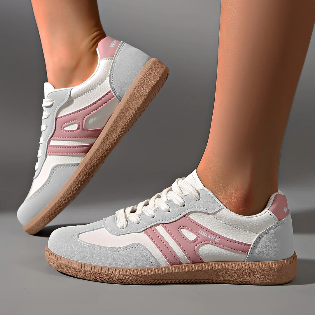 Ceridwen lace-up trainers in grey with pink stripes, worn side view