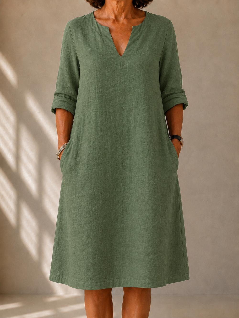 Lucie A-line side-pocket dress in sage green, front view