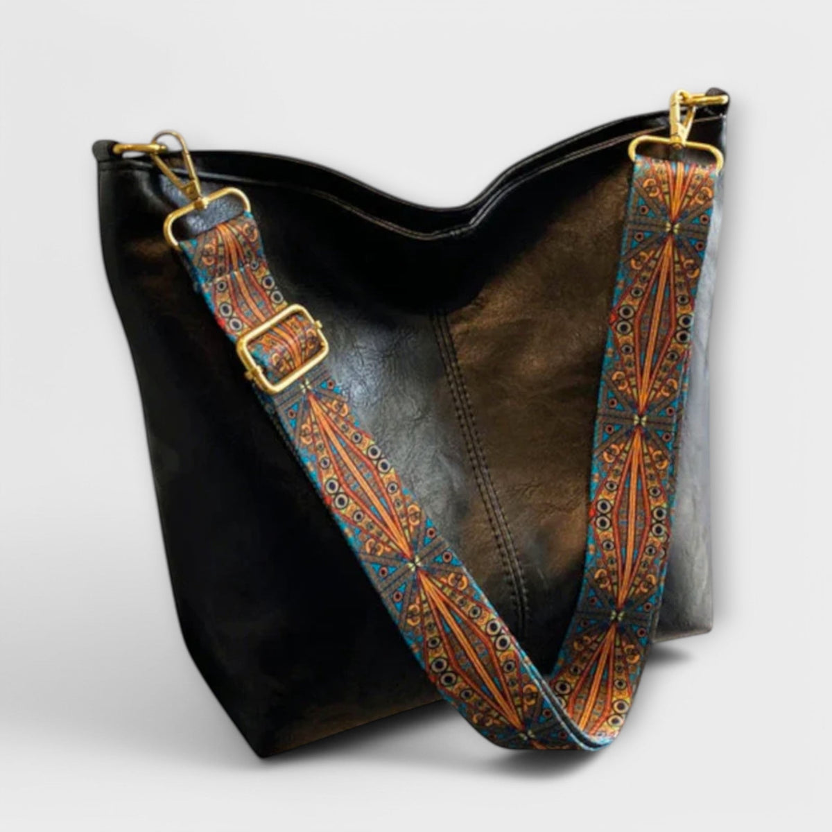 Agatha vintage shoulder bag in black with boho strap, angled view
