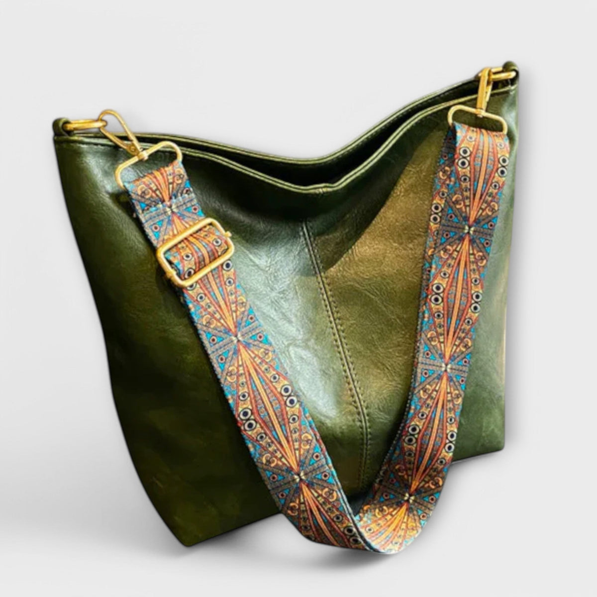 Agatha vintage shoulder bag in green with boho strap, angled view