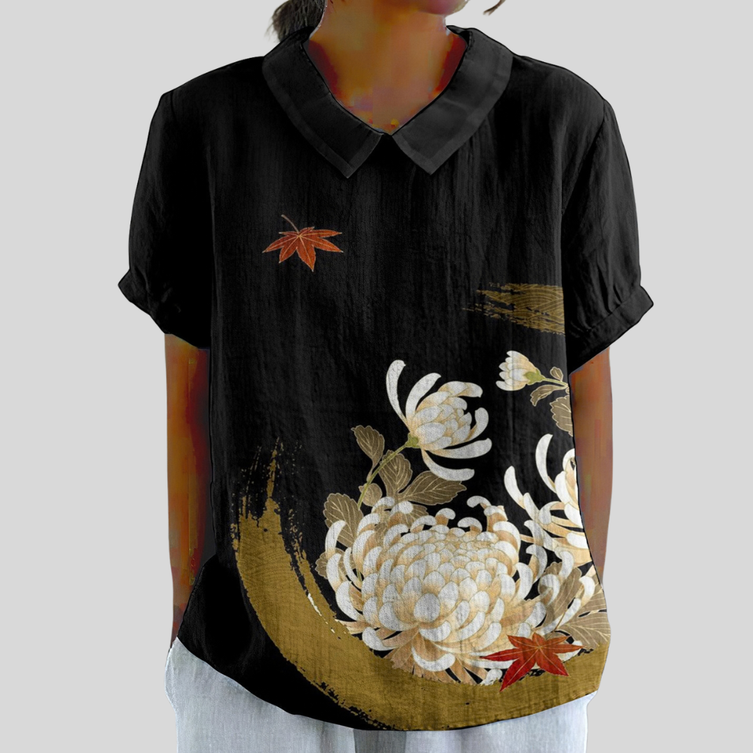 Amalthea collared blouse in black with white chrysanthemum and gold print, front view