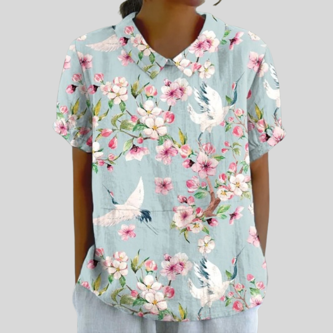 Lucienne collared blouse in duck-egg blue with pink blossom and crane print, front view
