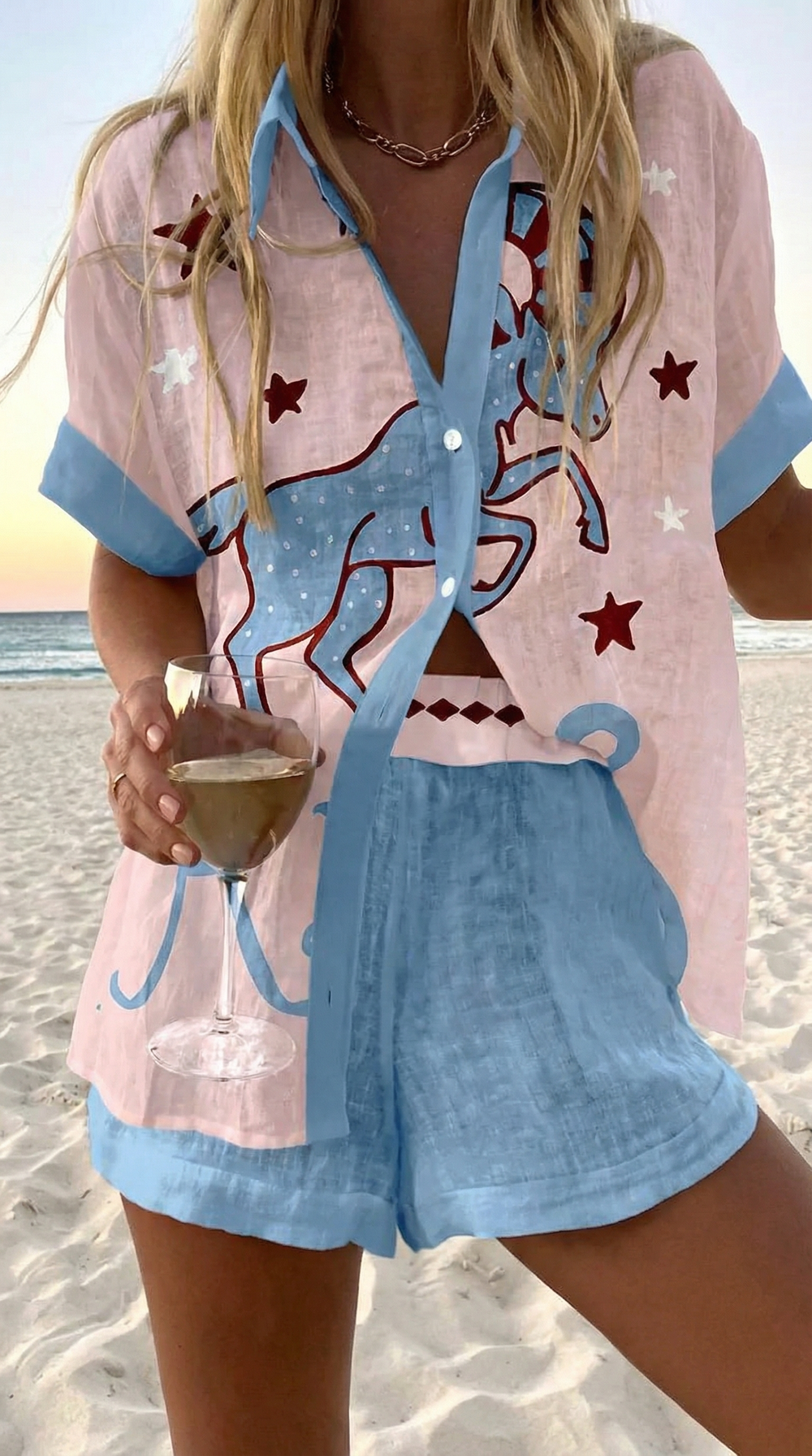 Luna summer co-ord set in pale pink and sky blue, close front view with horse and star print