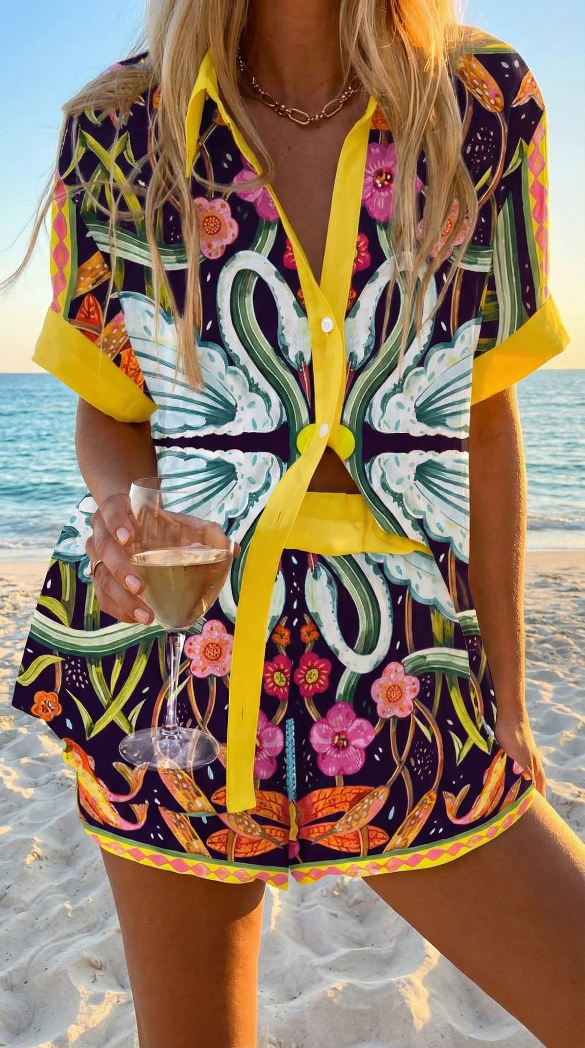 Sicilia summer co-ord set in dark botanical print with yellow trim, shirt and shorts front view
