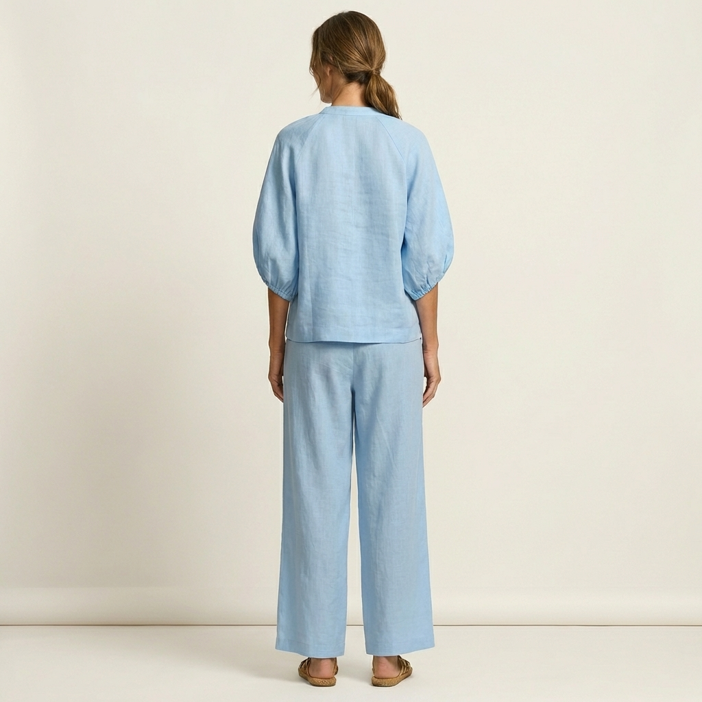Marlowe puff sleeve set in light blue, full-length back view