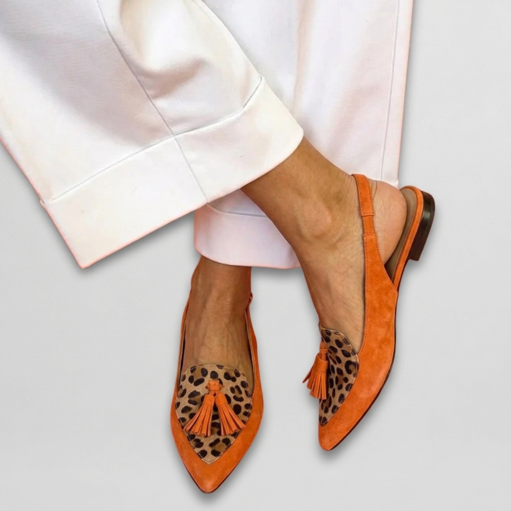 Arabella pointed loafers in orange leopard print, worn with white trousers