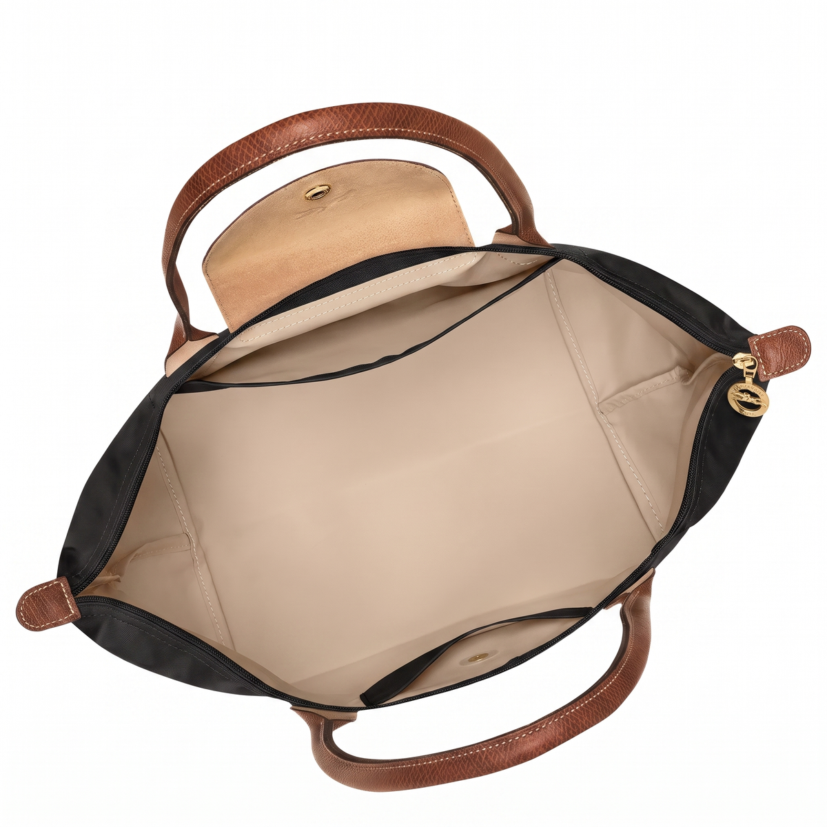 Inside of the black medium tote bag showing beige lining and slip pocket