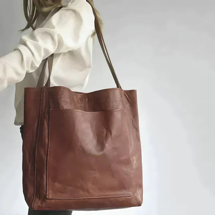 Pamela tote bag in dark brown leather worn over the shoulder