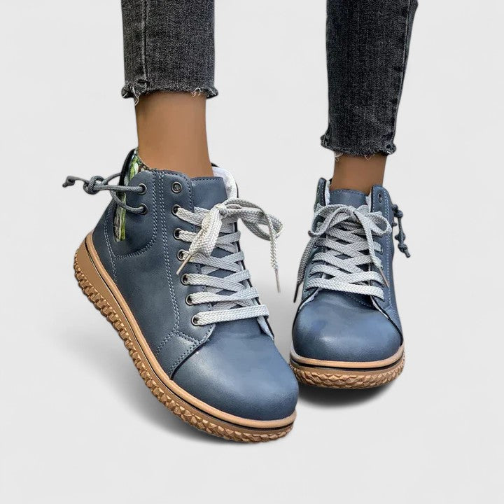 Brilly lace-up ankle boots in blue, worn front view with cropped jeans