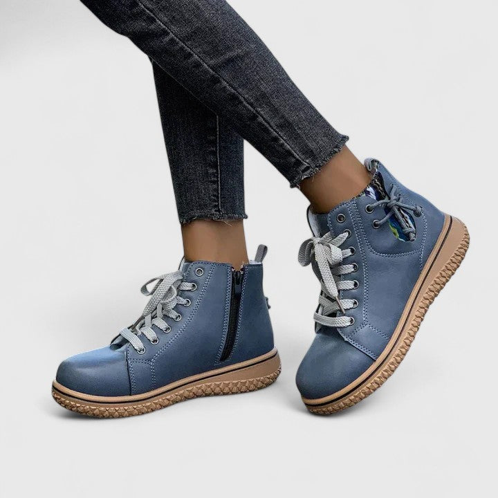 Brilly ankle boots in blue, angled view showing round toe