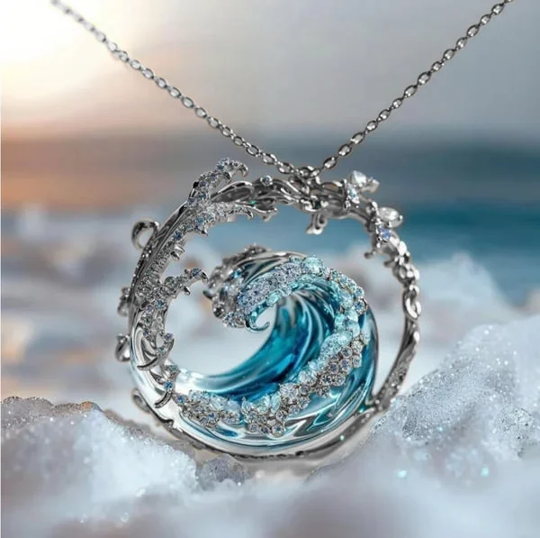 Eternal Wave necklace in silver with blue wave pendant, close-up view
