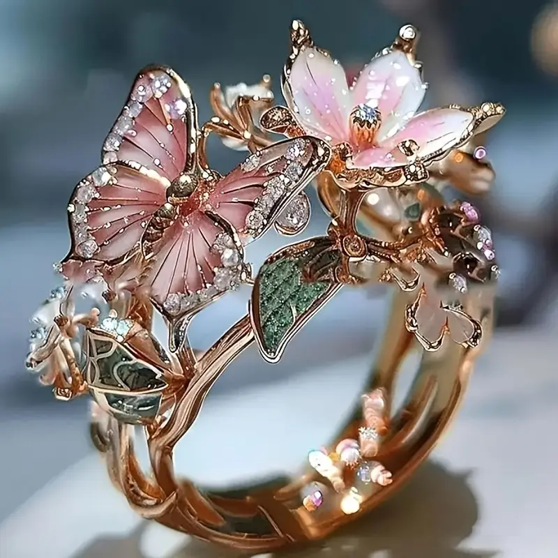 Butterfly zirconia ring in rose gold with pink enamel butterfly, close-up view