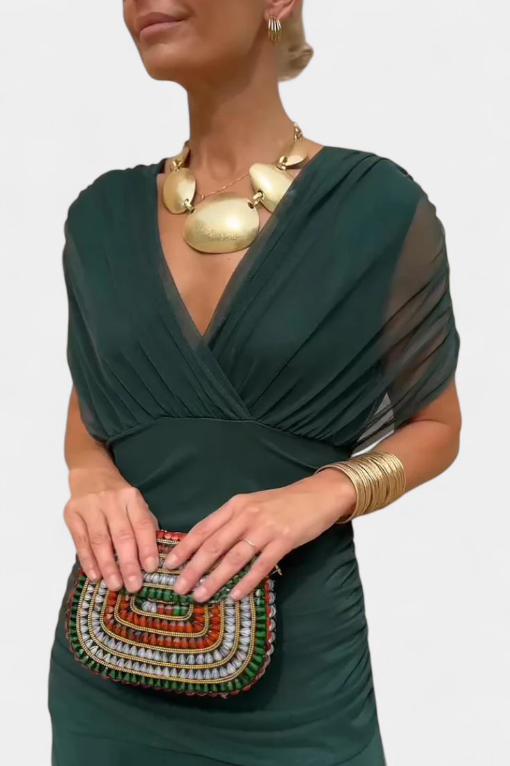 Florendra long dress in green, close-up of twisted V neckline