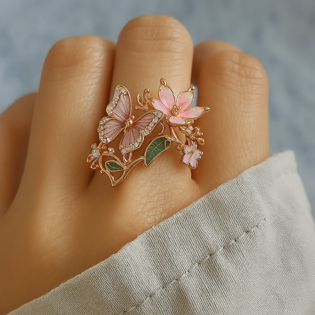 Butterfly zirconia ring worn on the finger, blossom and leaf detail