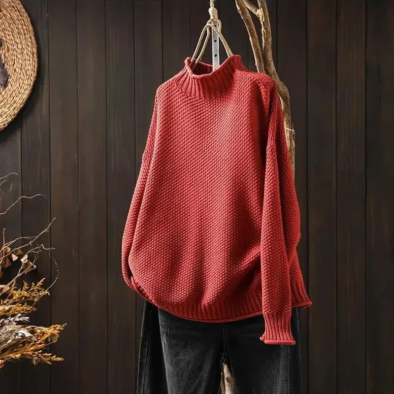 Aelyra chunky knit sweater in red, front view on hanger
