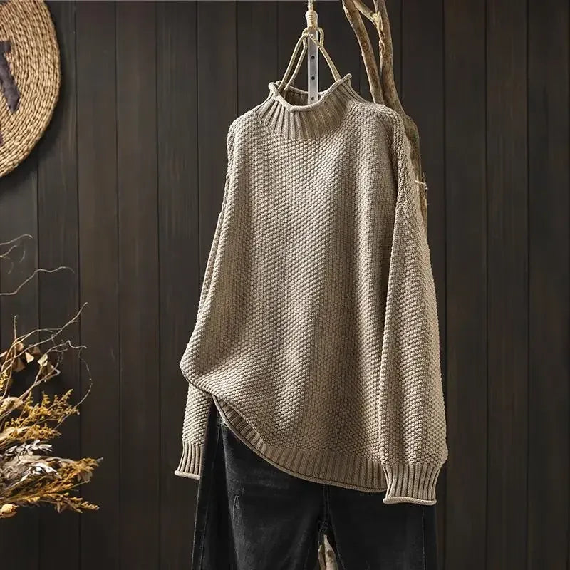Aelyra chunky knit sweater in khaki, front view on hanger