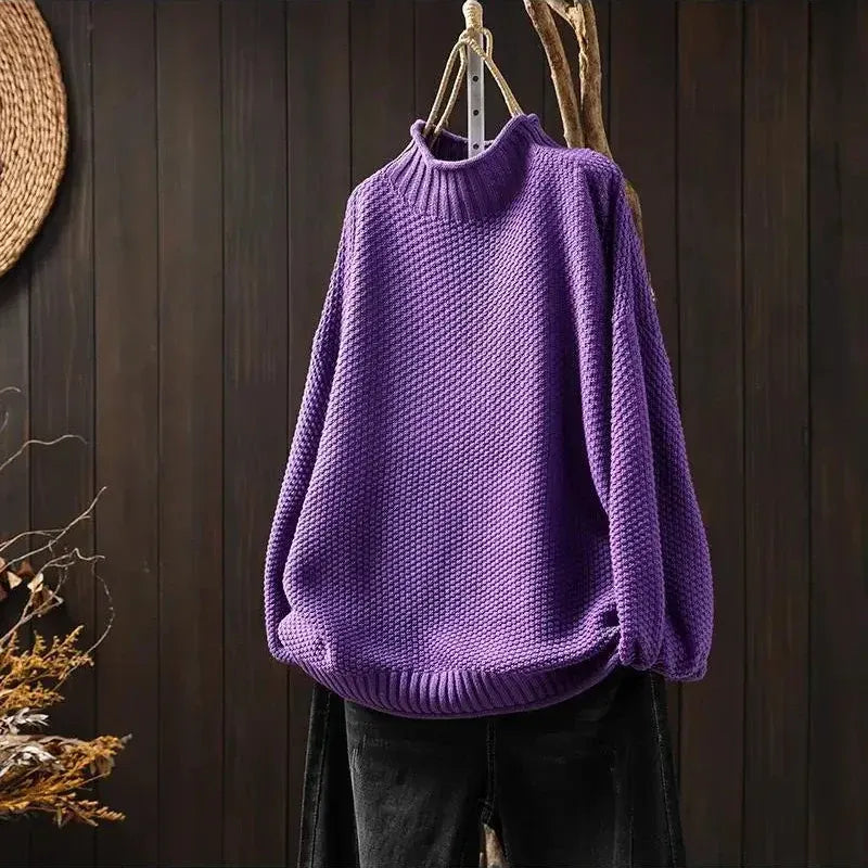 Aelyra chunky knit sweater in purple, front view on hanger