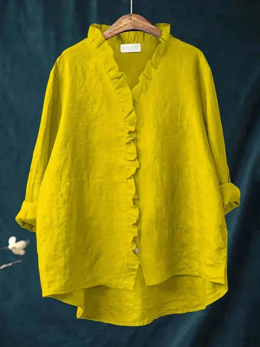 Thalia ruffled blouse in yellow, front view on hanger