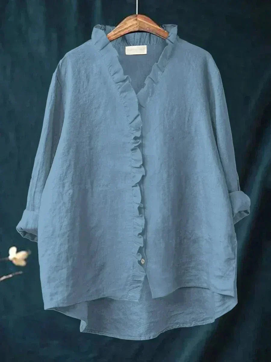 Thalia ruffled blouse in blue, front view on hanger