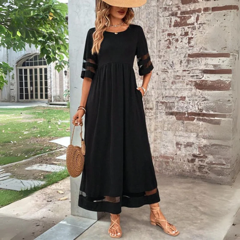 Cerelia midi dress in black, styled with straw hat and round rattan bag