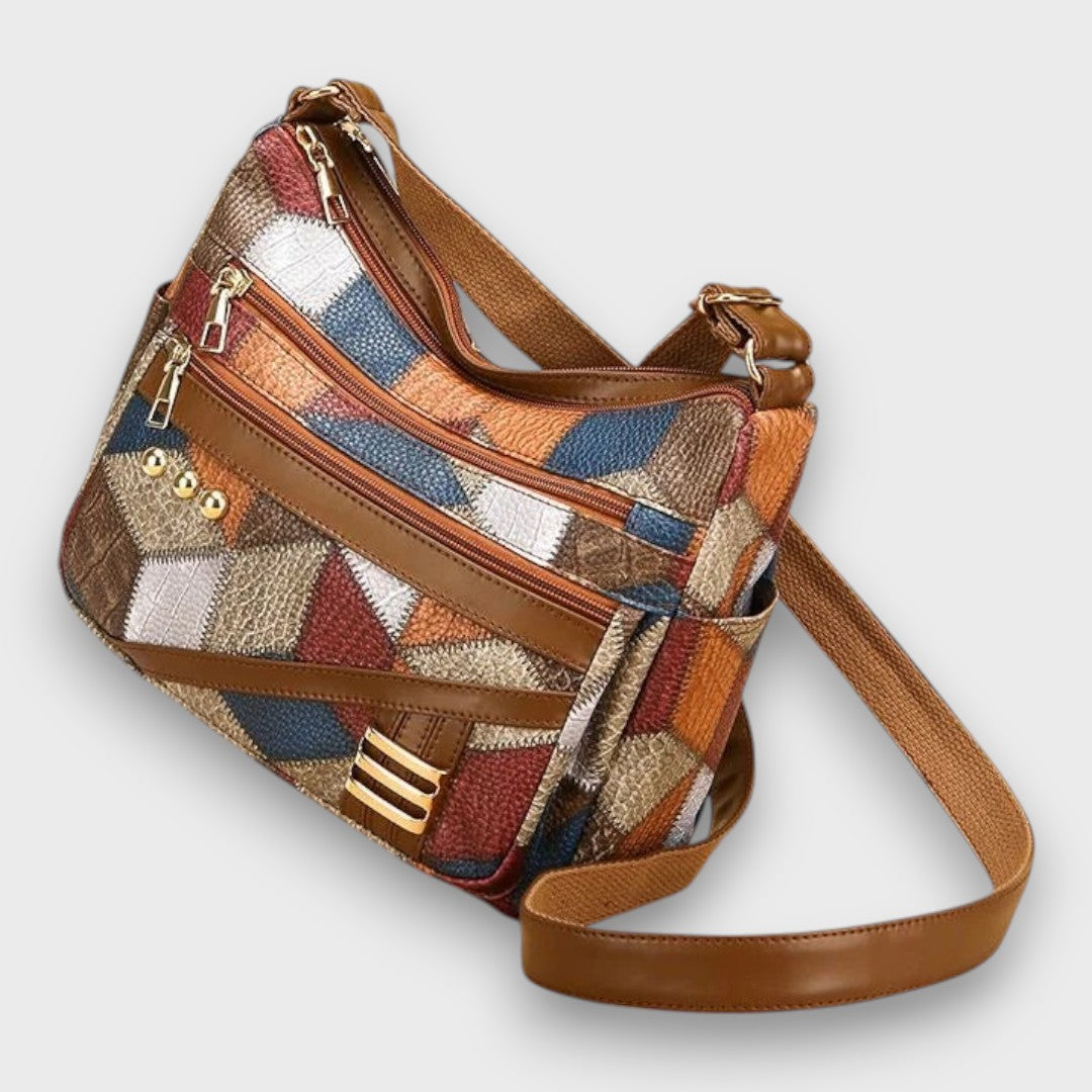 Maria patchwork shoulder bag angled view showing side slip pocket