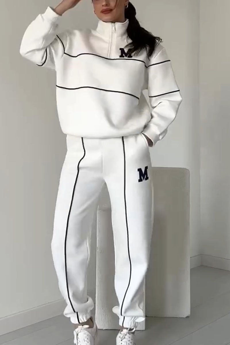 Thalynnae sweater and pants set in white, front view with varsity lettering