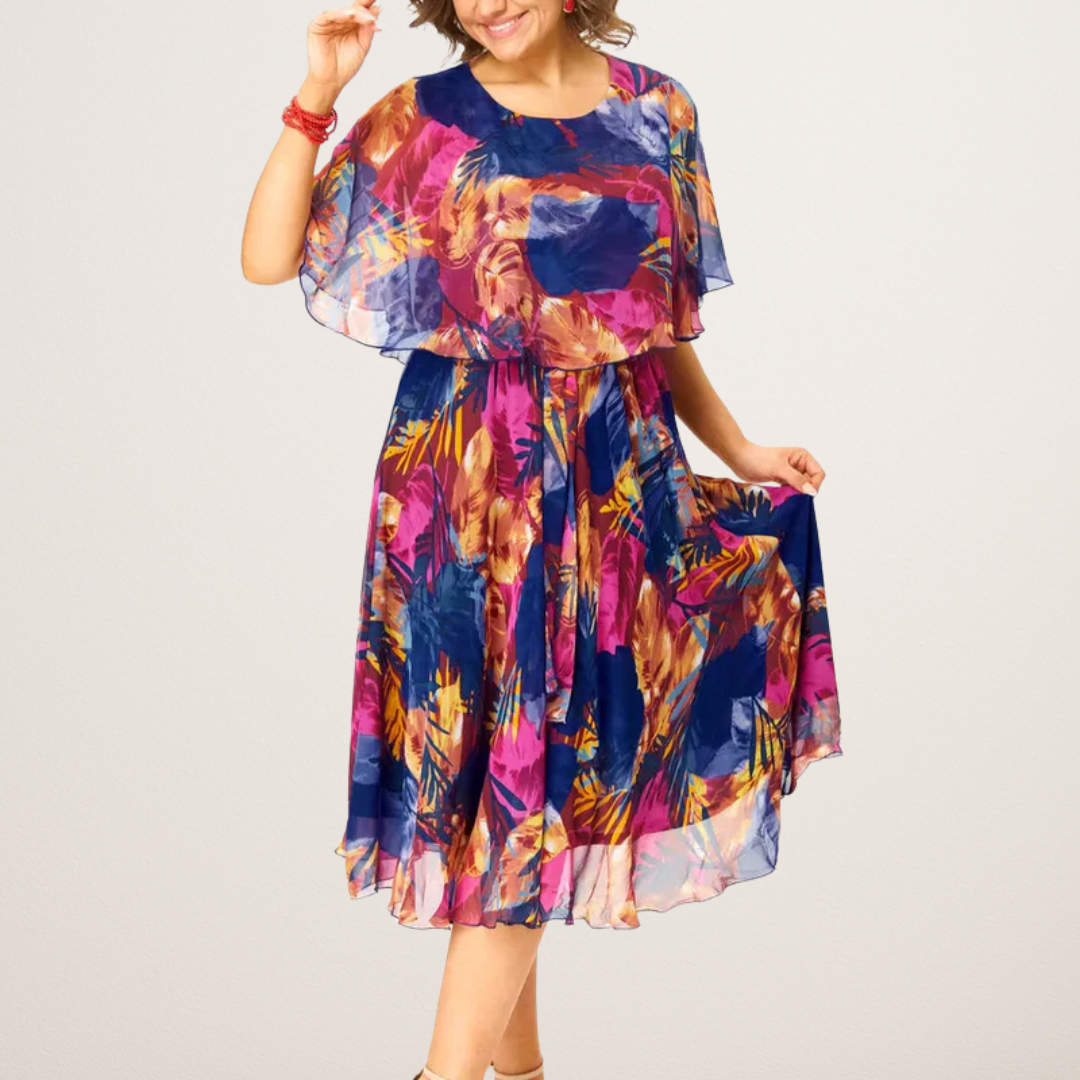 Barbara printed midi dress showing cape overlay, front view