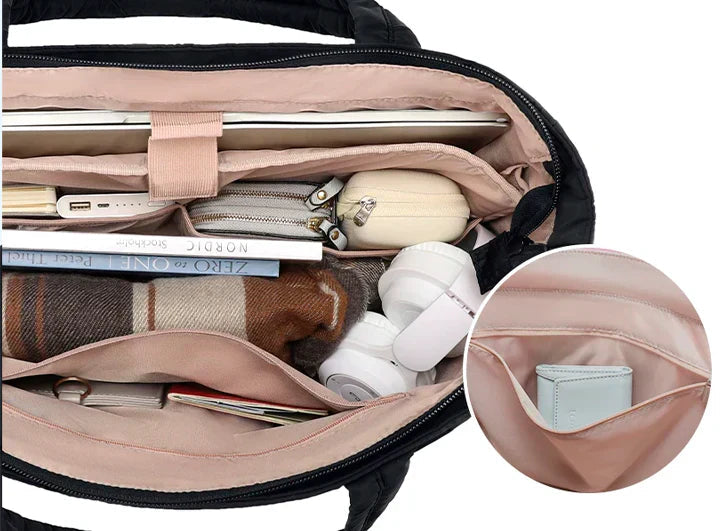 Calyss shoulder bag in black, inside compartments and pockets shown
