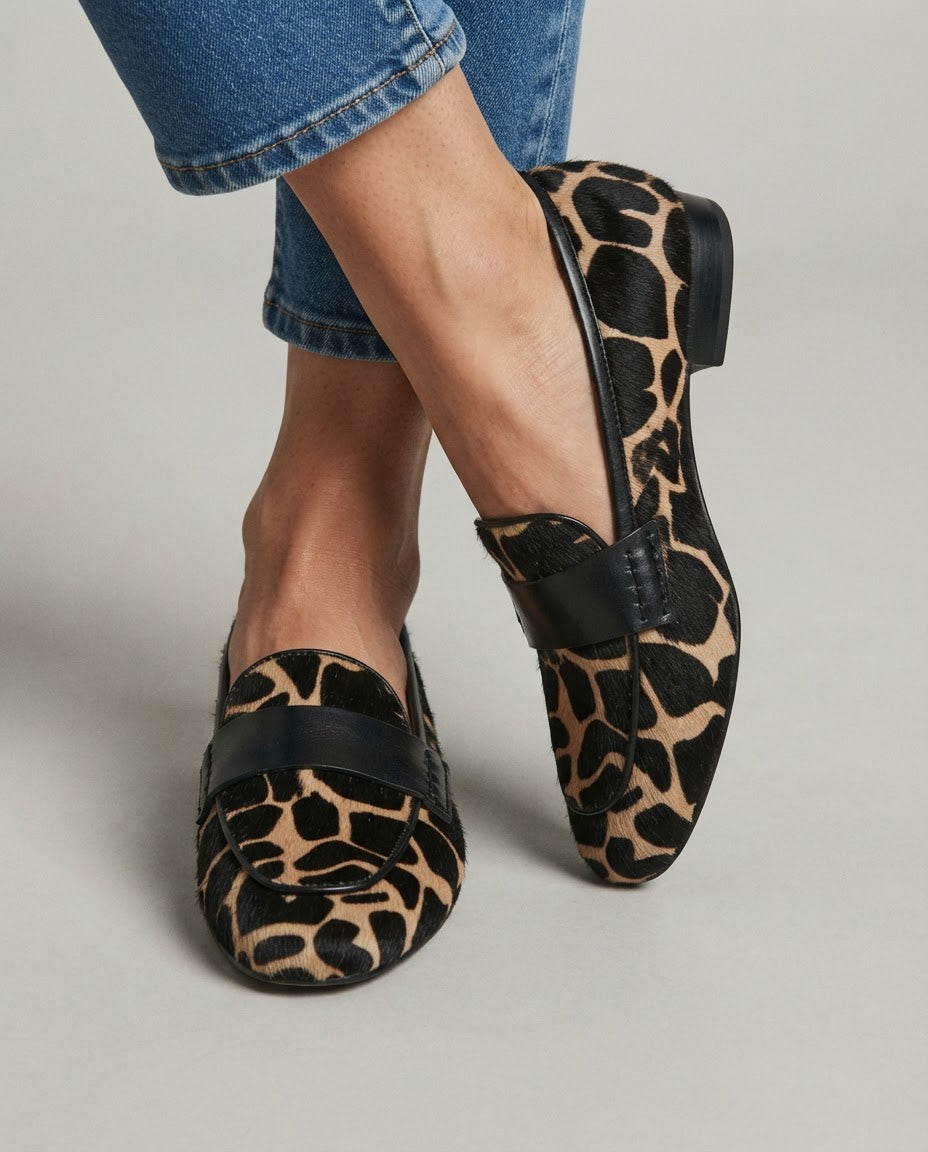 Giulia giraffe print loafers in apricot and black, worn with cropped jeans