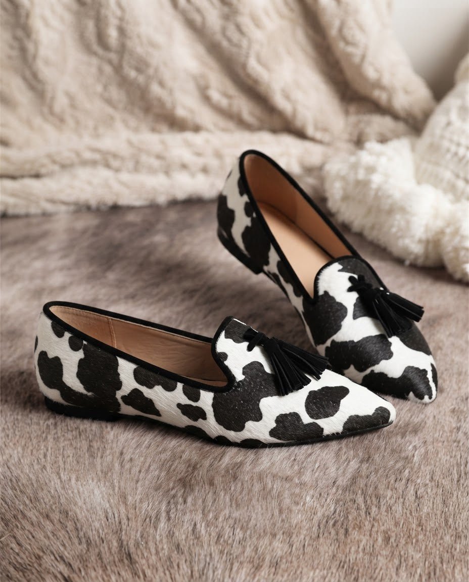 Ginevra cow print tassel loafers, pair shown side by side