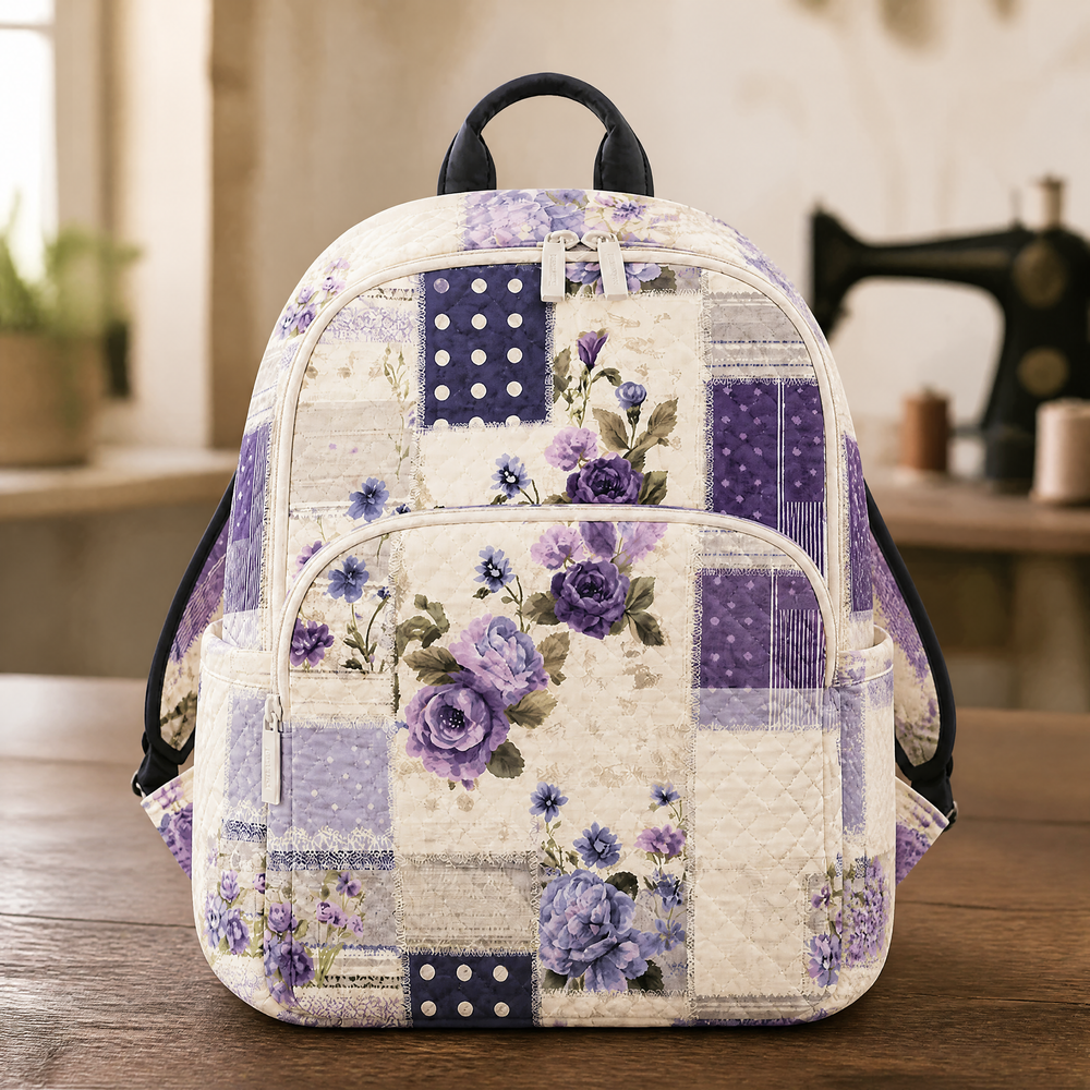 Purple floral patchwork quilted backpack, front view with zip pockets