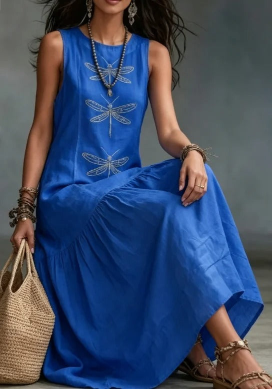 Daniela dress in blue, close view of dragonfly print bodice