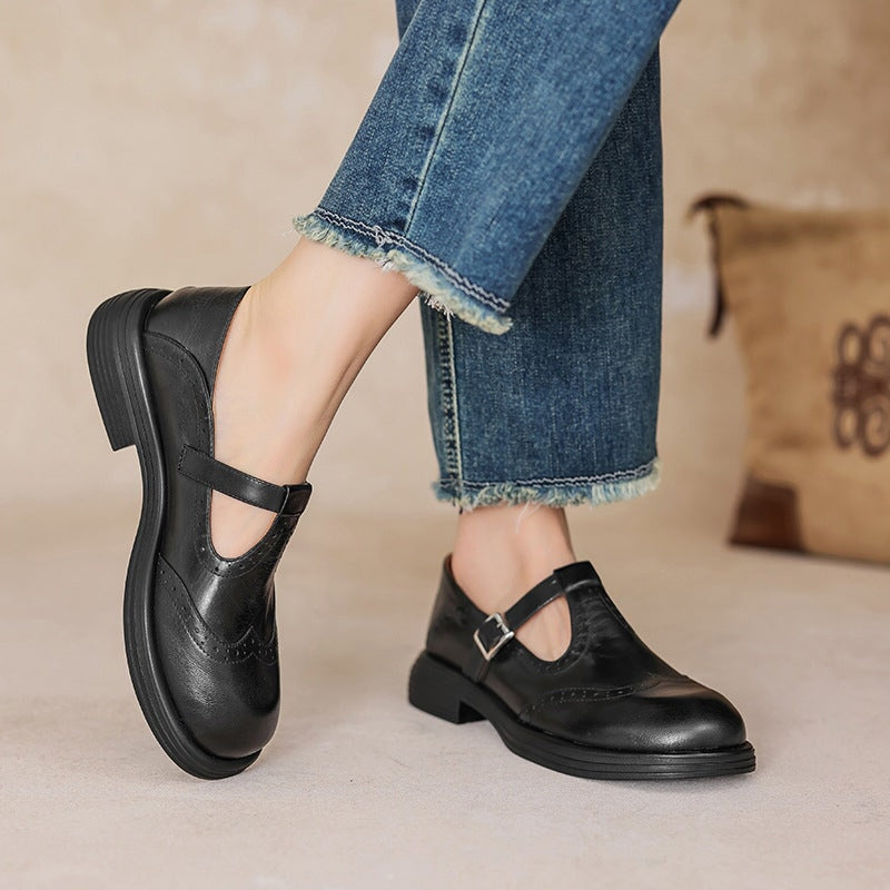 Talvanna Mary Janes in black worn with jeans, side view