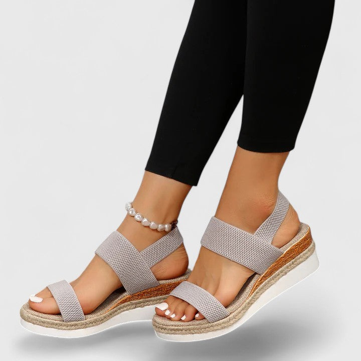 Merill orthopedic wedge sandals in grey, worn with leggings