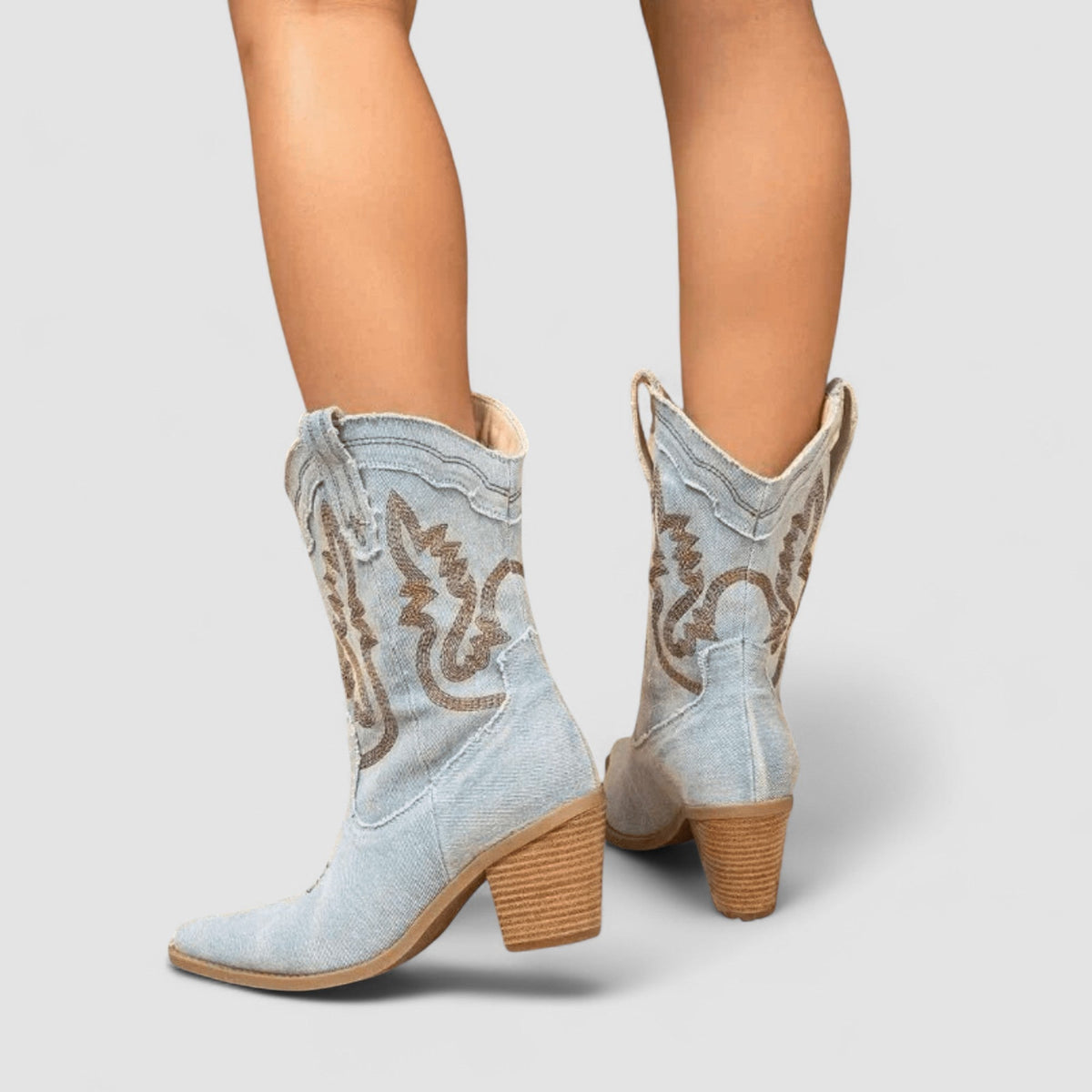 Callie western ankle boots in sky blue, back view on model